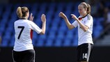 Annabel Jäger (left) congratulates Germany's hat-trick scorer Fabienne Dongus