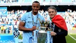 Vincent Kompany (left) helped City win their first Premier League title in May