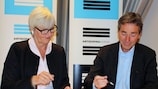 Valgerd Svarstad Haugland (AD Norway, left) and Marc Vouillamoz (UEFA) sign the agreement