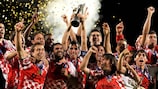 Castilla captain David Durantez hoists the UEFA Regions' Cup trophy aloft