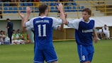 Футболисты "Приволжья" Александр Горбунов (слева) и Сергей Макаров (справа) радуются автоголу хозяев