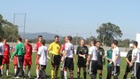 Zlín Region (red shirts) and Württemberg shake hands before the match in Fão