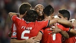 Luisão is mobbed after his goal