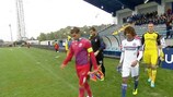 Steaua and Chelsea walk out for the start of the game
