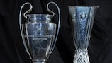The UEFA Champions League and UEFA Europa League trophies on display