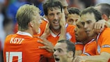 Ruud van Nistelrooy takes the congratulations of his team-mates after scoring the first goal