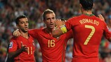 Simão (left) is congratulated by Raúl Meireles and Cristiano Ronaldo after giving Portugal the lead
