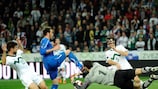 Italy's Giampaolo Pazzini (second left) competes with Samir Handanovič during their match in Ljubljana