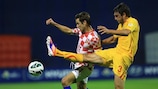 Croatia captain Darijo Srna (left) vies for possession with Goran Popov