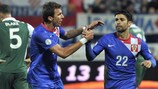 Mario Mandžukić and Eduardo celebrate the latter's goal as Croatia make it 2-0 in Osijek