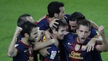 Lionel Messi (C) is congratulated after scoring his second goal on Sunday