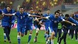 Greece celebrate after beating Romania to qualify for the World Cup
