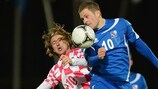 Luka Modrić and Gylfi Sigurdsson compete in the air in Reykjavik