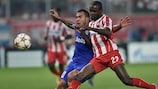 Carlos Tévez tussles with Éric Abidal during Juventus's defeat at Olympiacos