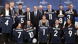 The members of the 11 Tricolores pose with shirts at the Stade de France in Saint-Denis