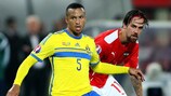 Sweden's Martin Olsson under pressure from Austria's Martin Harnik