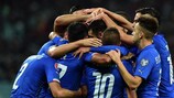 Italy celebrate their third goal in Baku