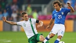 Ireland's Kevin Doyle challenges Italy's Andrea Pirlo at UEFA EURO 2012