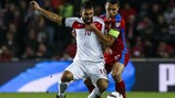 Arda Turan tussles with the Czechs' Marek Suchý during UEFA EURO 2016 qualifying