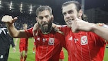 Joe Ledley and Gareth Bale celebrate after Wales sealed their finals place