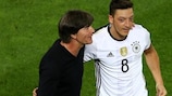 Germany coach Joachim Löw (left) celebrates with Mesut Özil