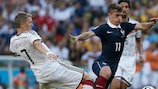 Bastian Schweinsteiger and Antoine Griezmann in FIFA World Cup quarter-final action