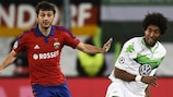 CSKA's Alan Dzagoev and Wolfsburg defender Dante in matchday one action