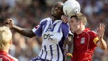 Toulouse defender Moussa Sissoko (left) goes up with Liverpool's Jamie Carragher