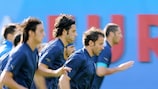 Italy players warm up during a training session in Vienna