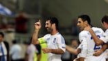 Giorgos Karagounis (left) leads the celebrations after scoring Greece's winner