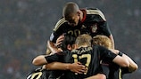 Sami Khedira is mobbed after his winner