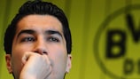 Nuri Şahin speaking at a conference to announce his departure from Dortmund to Real Madrid