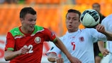 Igor Shitov of Belarus (left) competes for possession with Luxembourg's Tom Schnell