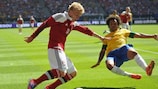 Denmark's Daniel Wass crosses under pressure from Brazil's Marcelo during their friendly
