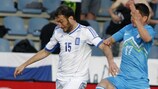 Greece's Vassilis Torossidis (left) in action against Slovenia