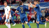 Mathieu Debuchy celebrates with Karim Benzema after scoring France's first goal