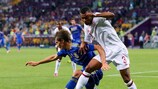 Ashley Cole battles for the ball with Denys Garmash at the Donbass Arena