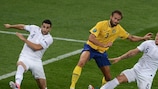 Sweden's Olof Mellberg battles for possession with a clutch of France players