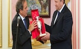 UEFA President Michel Platini (left) presents Ukraine's President Viktor Yanukovych with a replica of the Henri Delaunay Cup