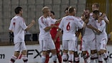 Leon Andreasen is congratulated after putting Denmark ahead