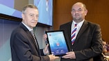 Mircea Sandu (left) presents Miroslav Pelta with the FAČR's UEFA HatTrick Award