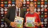 Professor Pekka Puska, World Heart Foundation president, and England player Kelly Smith promote Eat For Goals!