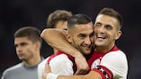 Hakim Ziyech (left) and match-winner Dušan Tadić celebrates Ajax's win against PAOK in the third qualifying round