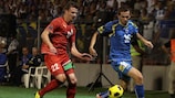 Senad Lulić comes under pressure from Belarus's Igor Shitov
