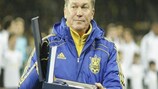 Oleh Blokhin, in familiar solemn pose, receives UEFA's commemorative cap and medal for winning 100 caps