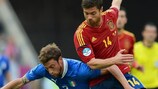 Claudio Marchisio (left) tussles with Spain's Xabi Alonso