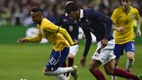 Neymar gets away from France goalscorer Raphaël Varane