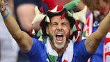 An Italy fan enjoys himself at a game