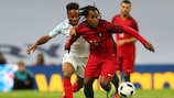 England's Raheem Sterling (left) challenges Renato Sanches of Portugal