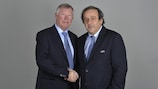 Sir Alex Ferguson shakes hands with Michel Platini following his appointment as UEFA Coaching Ambassador